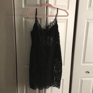 Fashionnova black lace dress. Dress includes underwear covering. Zip up back